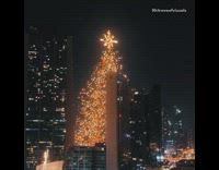 Decorated christmas tree set up outside 