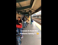 Woman with very long hair yellow jacket in metro station