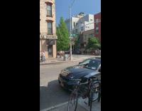 Black lingerie spiky crown girl dances sidewalk 