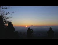 People stand at top of mountain sunrise 
