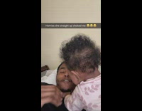 Guy records baby with hands on his neck