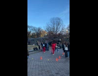 Guy jumps woman back does back tuck