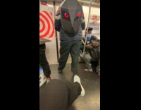 Collab Subway Creatures - Black bag with eyes blink in train red white plastic bag in mans hand