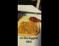 Woman puts pizza sauce on sandwich