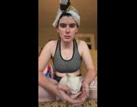 Girl makes introduction video for her white cat lotion 