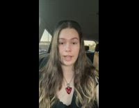 GIrl sitting in car pro tip playing just dance 