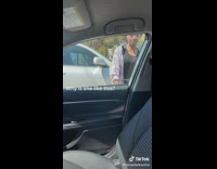 Daughter picks up rock from outside