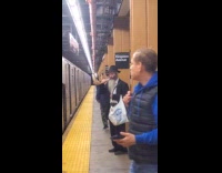 Jewish man blows  shofar at the subway