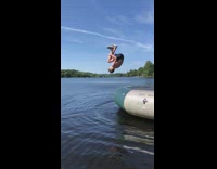 Guy backflip hits face inflatable trampoline lake 