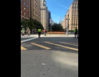 Woman on street wearing puffer jacket on hot weather