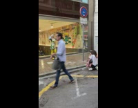Person in a green dress costume sidewalk photoshoot
