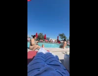 Two women in bikini photoshoot at poolside