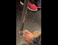 Subway passenger with overgrown toenails