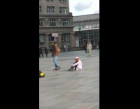 Tourists pose outside cathedral 