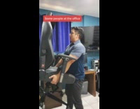 Coworker walks in on guy squatting with chair 