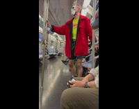 Guy wearing bunny mask on subway playing his own song on speakers