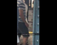 Toilet paper hangs out of mans back side butt while he walks in subway station