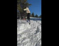 Skier tries to do a spin off a jump but fails and falls instead 
