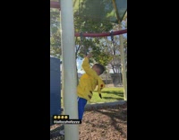 Kid falls off monkey bars lands on metal bar 