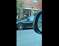 Woman fix dress while walking on street