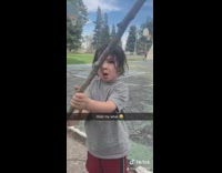 Little boy spins stick and says hold my dick at playground