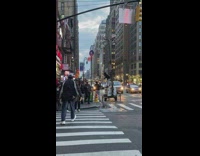 Guy standing on portable floodlight generator raps 