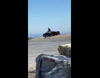 Guy sit pose over black car mountain
