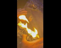 Collab BitchMP - Hands on pair of blue jeans being dyed and printed on by laser