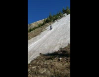 Guy slides down on butt melting snow 