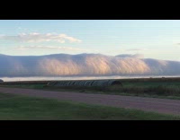 Man shows arcus clouds formed on sky