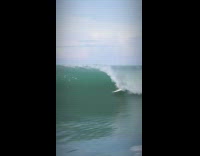 Drone footage of professional surfers at beach