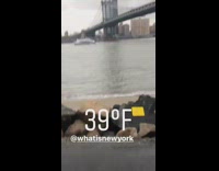 Girl walks by guy in river water