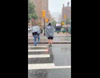 Guys wears plastic bag cross the road