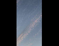 Strange scattered clouds formation on sunset sky