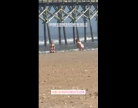 Girl black bikini kneel beach pier bridge