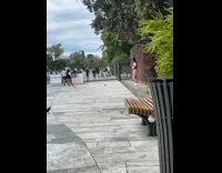 Girl pink pantss dance beside restroom area