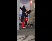 Collab WINY - Couple in Disney Costume Kiss on Sidewalk