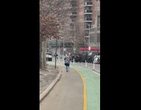 Man Spins Hula Hoop as he Jogs and Rest