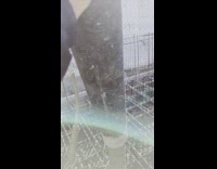 Man Shows Concrete Pumper and Pushes Tube 