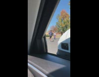 Two guys purple pants dance parking lot