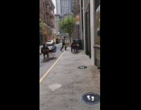 Woman orange table and chair photo shoot social distance