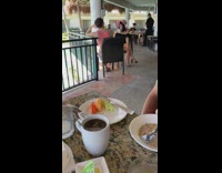 Girl white red hat adjust cleavage breakfast