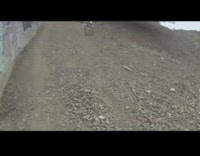 Man in bright green falls face forward bike