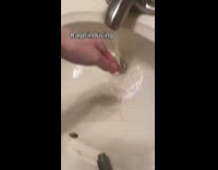 Woman frustrated faucet being close to corner of sink