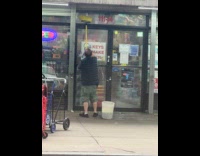 Man use broom to clean store door
