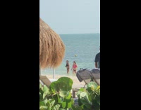 Two women dipped hair flip in sync