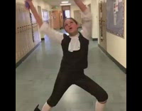 Girl in old fashioned clothing spread legs on the floor and rips splits pants open in crotch area