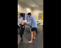 Guy kicks cushion on friends leg and the force knocks him over