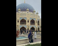 Woman in green top bends on the fountain park