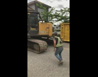 Guy construction vehicle excavator mall bridge entrance